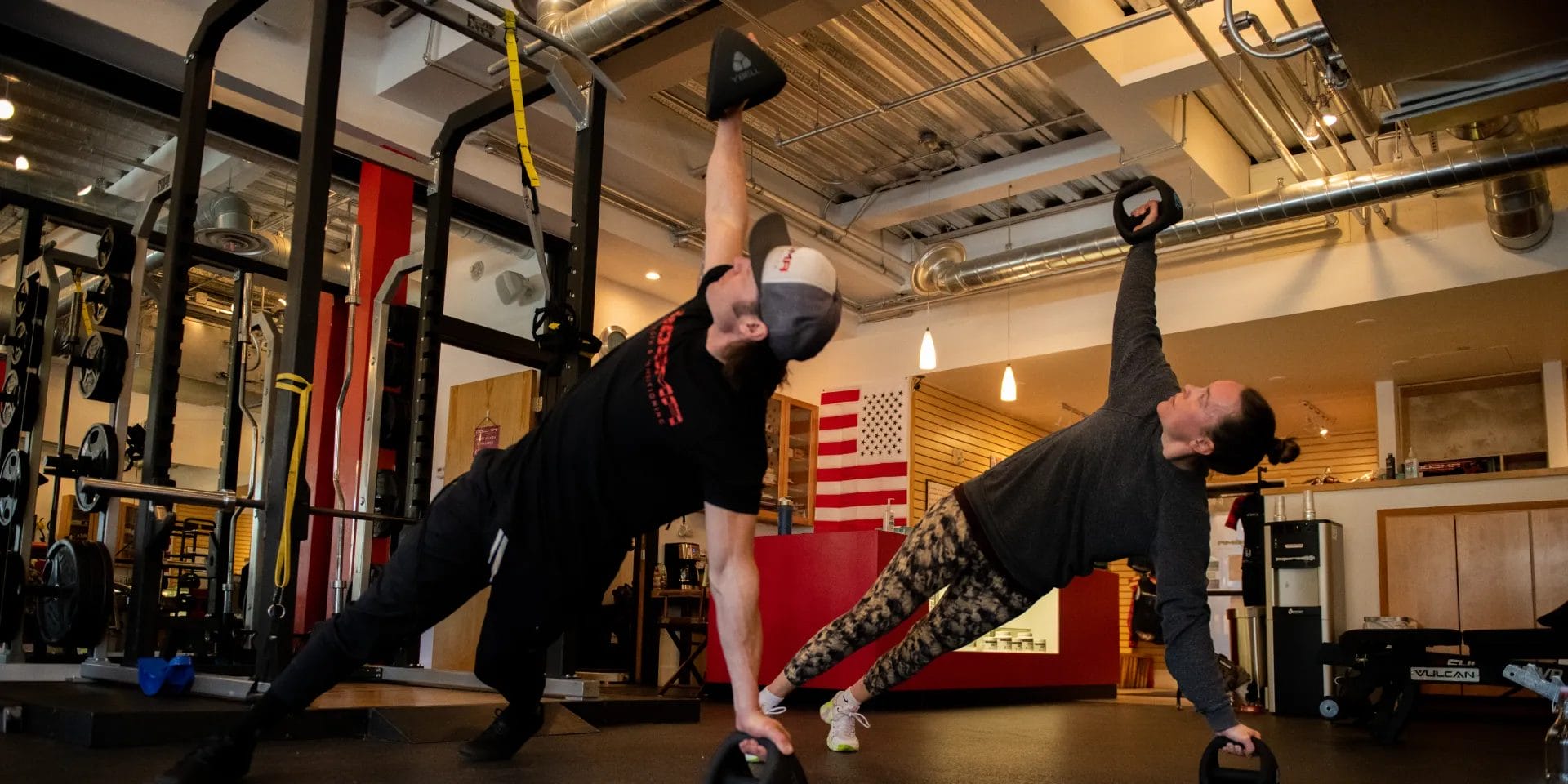 Man and woman doing YBell exercise